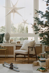Modern Christmas window decor with star lanterns, cozy pillows, and a hint of holiday magic. Inviting winter home setting.
