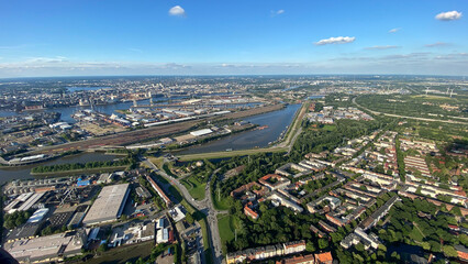 Aerial View of Urban Landscape with Lush Greenery and Rivers