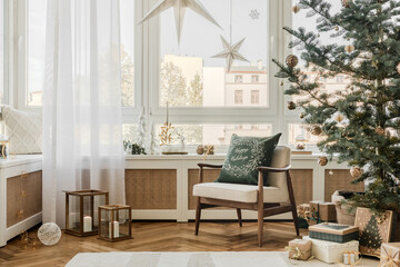 Modern Christmas living room with minimalistic decor, a festive tree, and cozy seating. Peaceful holiday interior setting.