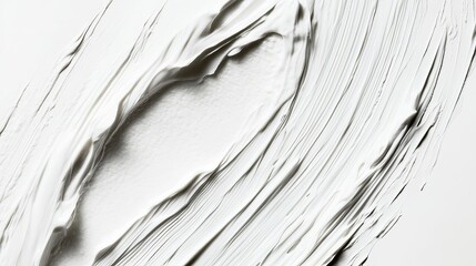 A smooth texture of white cosmetic cream, with a lotion smear. The creamy skincare product swatch is isolated on a white background, showcasing its soft and rich consistency.