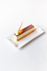 Portrait of funny young retro girl photographer in white clothes at home background, holds camera in hands, looks into camera with smile