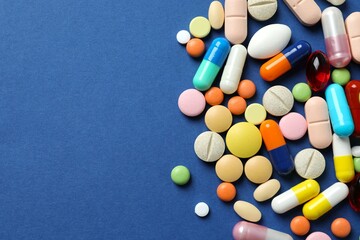 Various medicine pills on color background 