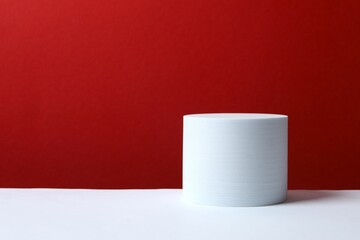 White podium on color background 