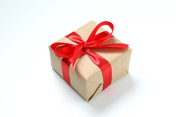 Obraz premium Beautiful gift box tied with golden bow on color background 