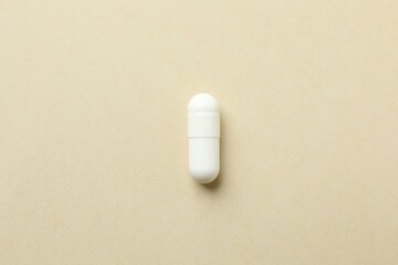 White pill on color background