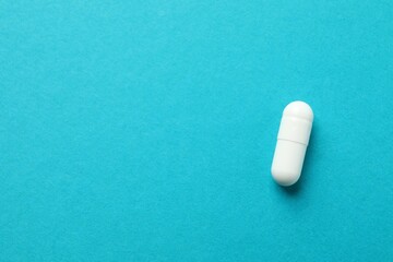 White pill on color background