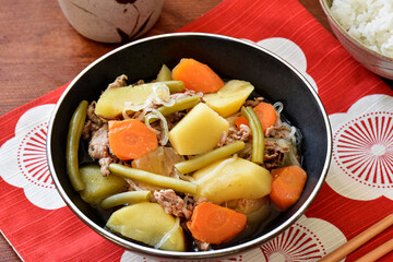 Nikujaga is a comforting Japanese dish of simmered beef, potatoes, and onions in a mildly sweet soy sauce broth. Often served as a homestyle meal, it’s savory, hearty, and perfect for cold days.