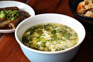 Miso soup with tofu and spinach is a savory Japanese broth made from miso paste, enriched with soft tofu, tender spinach, and dashi for a comforting, umami-packed dish.