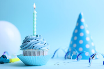 A deliciously appealing and beautifully decorated Frosted Birthday Cupcake topped with a Candle