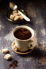 Mug of coffee on rustic wooden background. Copy space