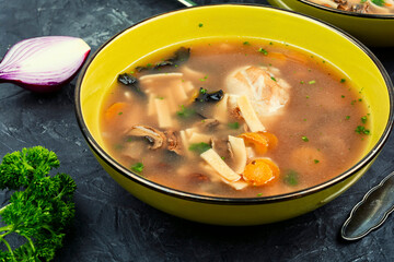 Bowl of chicken noodle soup.