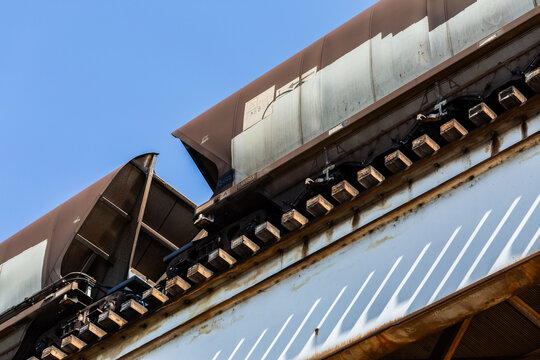 Coal train on overhead railway tracks transporting Australian exports