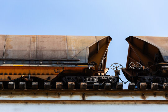 Coal train on overhead railway tracks transporting Australian exports