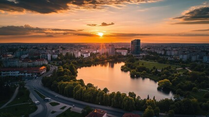 Fototapeta premium Cityscape with Sunset and Lake