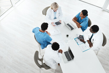 Doctor, team and meeting with tablet in boardroom with CT scan for brain analysis, surgery planning...