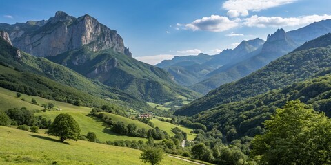 Naklejka premium Majestic Landscape of Oral Valley in the Pyrenees, Spain: Serene Nature Scene with Lush Green Hills, Clear Blue Sky, and Dramatic Mountain Backdrop, Perfect for Travel Inspiration