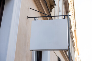 Street storefront shop, cafe, restaurant mounted signboard mock up design template. Blank white...
