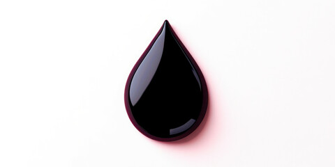 Obraz premium A drop of dark liquid is shown on a white background