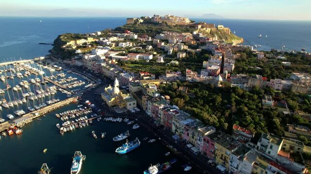 Italy travel and landmarks. Most scenic and colorful island - beautiful Procida in gulf of Naples. Port of Corricella . aerial 4k hd drone video
