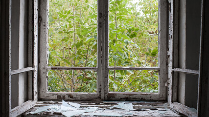Smashed glass Window with old wooden frame. old window. finely broken glass. old house, retro....