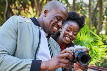 Happy Couple Enjoying a Day Outdoors and Sharing a Moment with a Camera