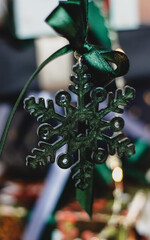 Green Christmas tree ornament with satin bow, festive holiday decoration symbolizing seasonal joy and elegance in lush green hue