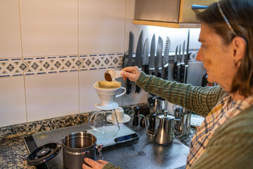 Woman Brewing Coffee in Modern Kitchen