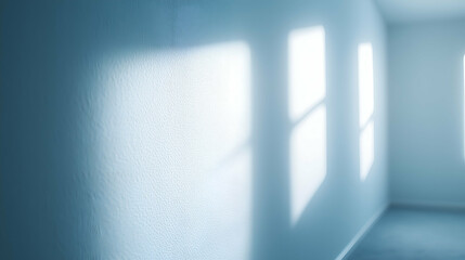 Naklejka premium Minimalist Interior with Soft Window Light and Shadows - A serene interior featuring soft natural light streaming through windows, casting 