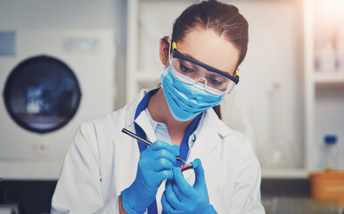 Scientist, woman and writing in lab with blood sample, tube and face mask for safety with process for virus. Person, label and notes with ppe, innovation and medical research for vaccine development