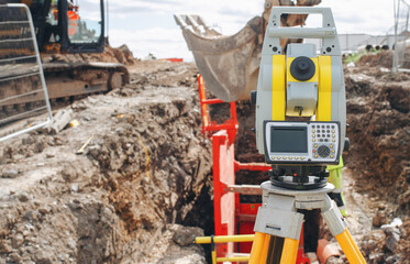 Surveying equipment positioned near drainage deep excavation