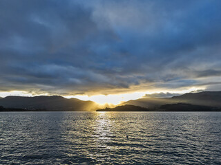 Serene Sunset Over Mountain Lake