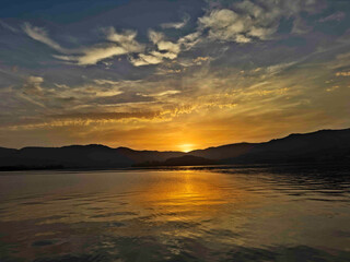 Serene Sunset Over Calm Lake