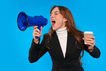 Businesswoman with a megaphone and coffee cup passionately speaks against a bright blue backdrop