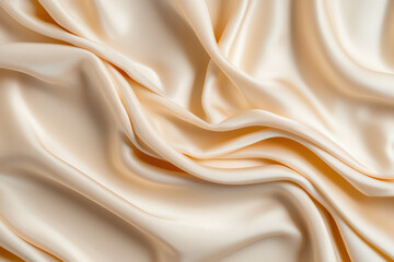 Obraz premium Elegant cream fabric draping softly, showcasing smooth texture and sheen. Ideal for backgrounds, fashion, or interior design projects.