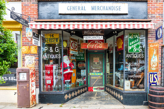 THOMASVILLE, NC, USA-8 MAY 2022: Close image of vintage General Merchandise store.  Windows filled with iconic items.  Colorful, worn facade.
