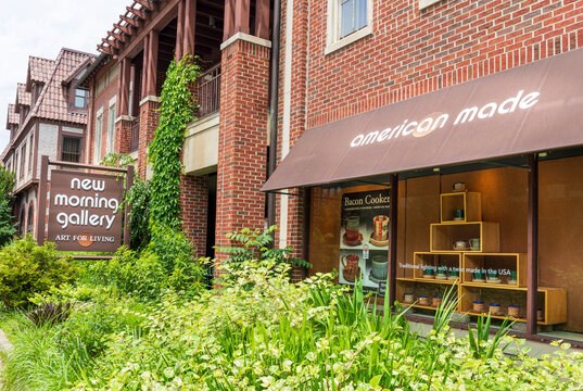BILTMORE VILLAGE in ASHEVILLE, NC, USA-5 JUNE 2022: New Morning Gallery. Display window and monument sign.  Horizontal image