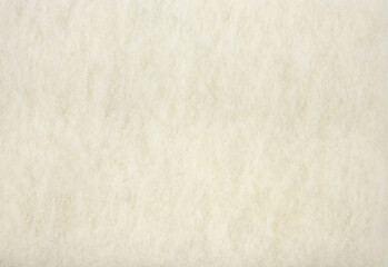 Natural pressed sheep wool felt textile fabric. Natural material concept.