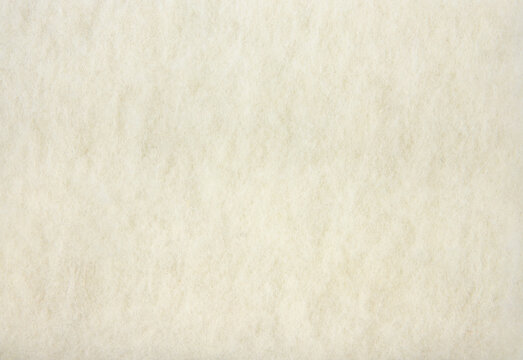 Natural pressed sheep wool felt textile fabric. Natural material concept.