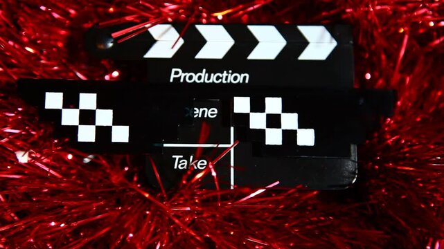 footage of clapper board sunglasses red tinsel background