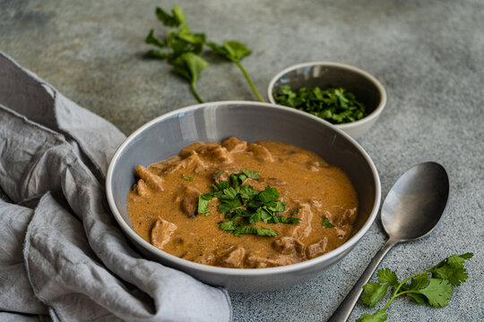 Delicious beef stroganoff with creamy sauce and fresh garnish