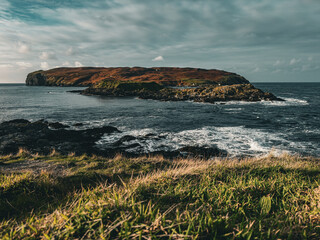 Moody gothic landscape view over the Irish Sea and Sound to the Calf of Man from the south of the...