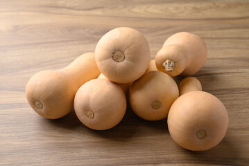 Butternut squash pumpkin on wooden background