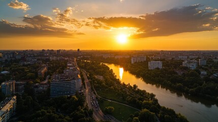 Obraz premium Golden Sunset over the City and River