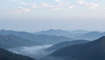 Naklejka premium Misty mountain landscape at dawn, serene natural scenery