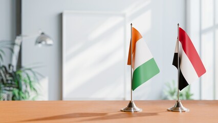 FLAGS OF IVORY COAST AND YEMEN ON TABLE