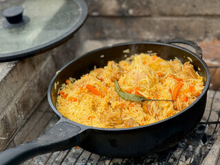 Traditional Pilaf Dish Cooking in Outdoor Pot