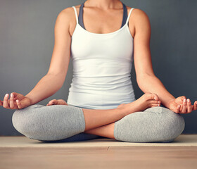 Lotus pose, yoga and body of woman on floor with balance, calm and peaceful exercise in morning. Meditation, zen and female person with padmasana for spiritual energy, health and wellness in home.