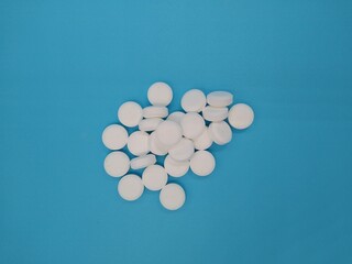 Medicine Pills on Pure Blue Background
