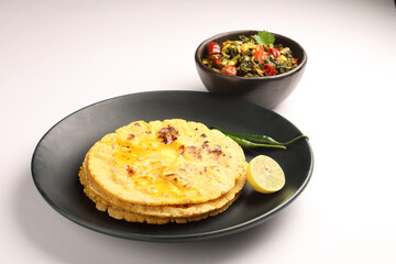 Makai roti with Sarson ka saag, also known as sarsa da saag, is a dish of mustard greens cooked with spices. It originated in the Punjab region and is popular throughout the South Asia.