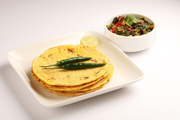 Makai roti with Sarson ka saag, also known as sarsa da saag, is a dish of mustard greens cooked with spices. It originated in the Punjab region and is popular throughout the South Asia.